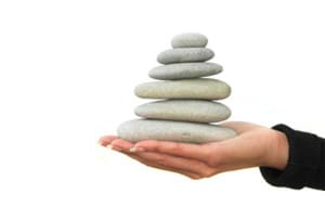 Stacked rocks to symbolize Lean and Six Sigma foundation.